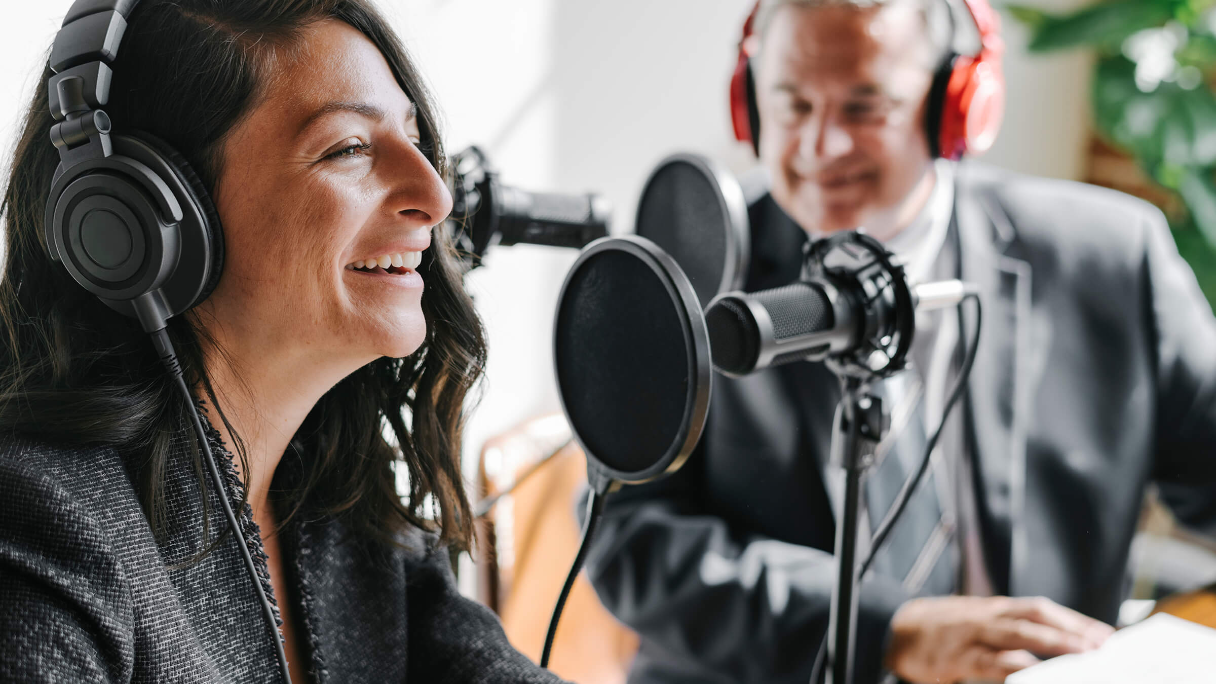 Two people doing an audio broadcast
