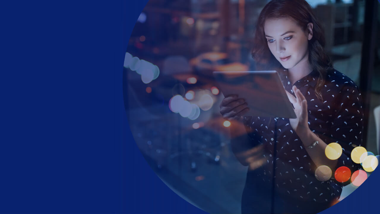 female standing holding tablet