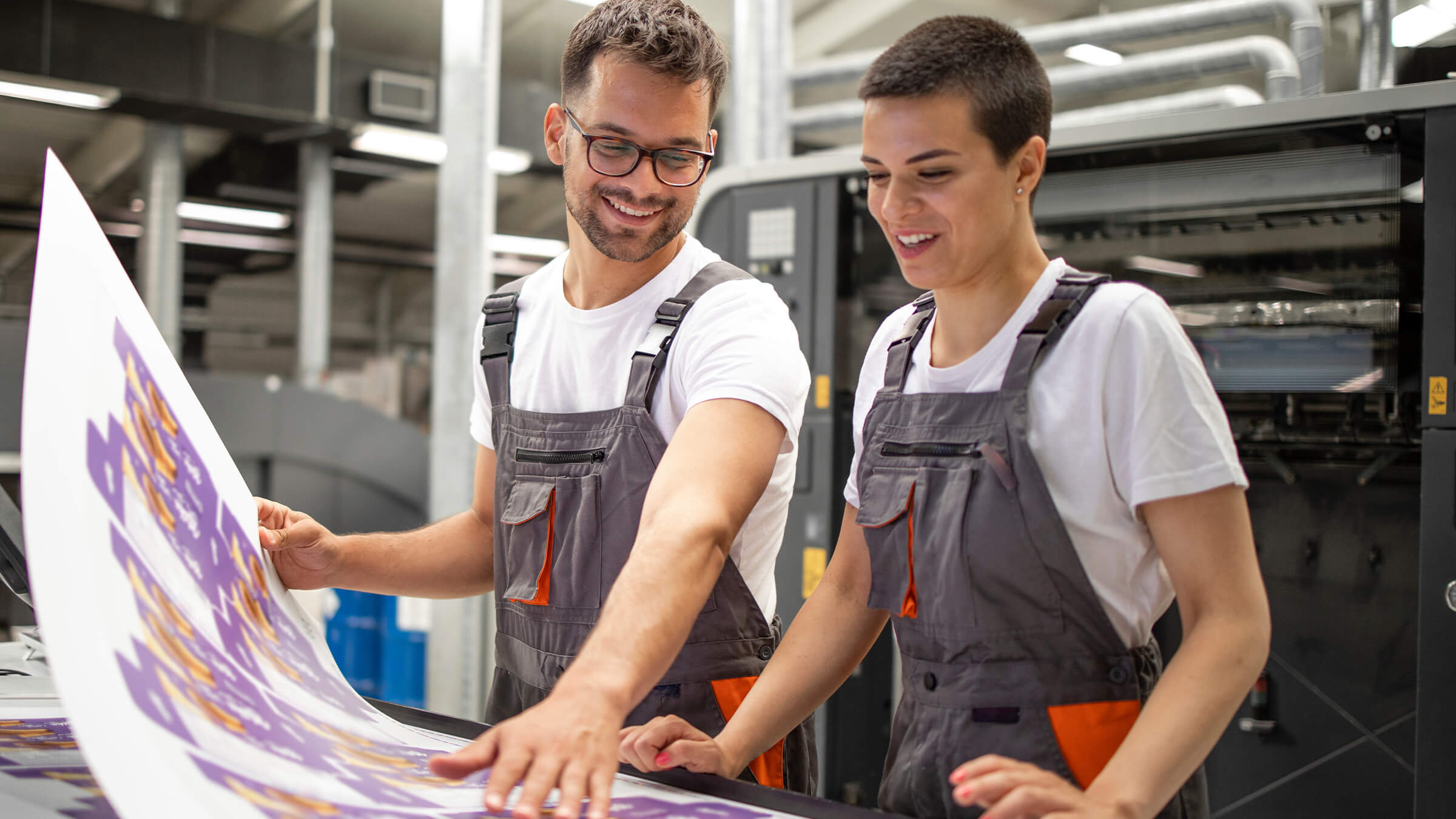 People working on printing press}